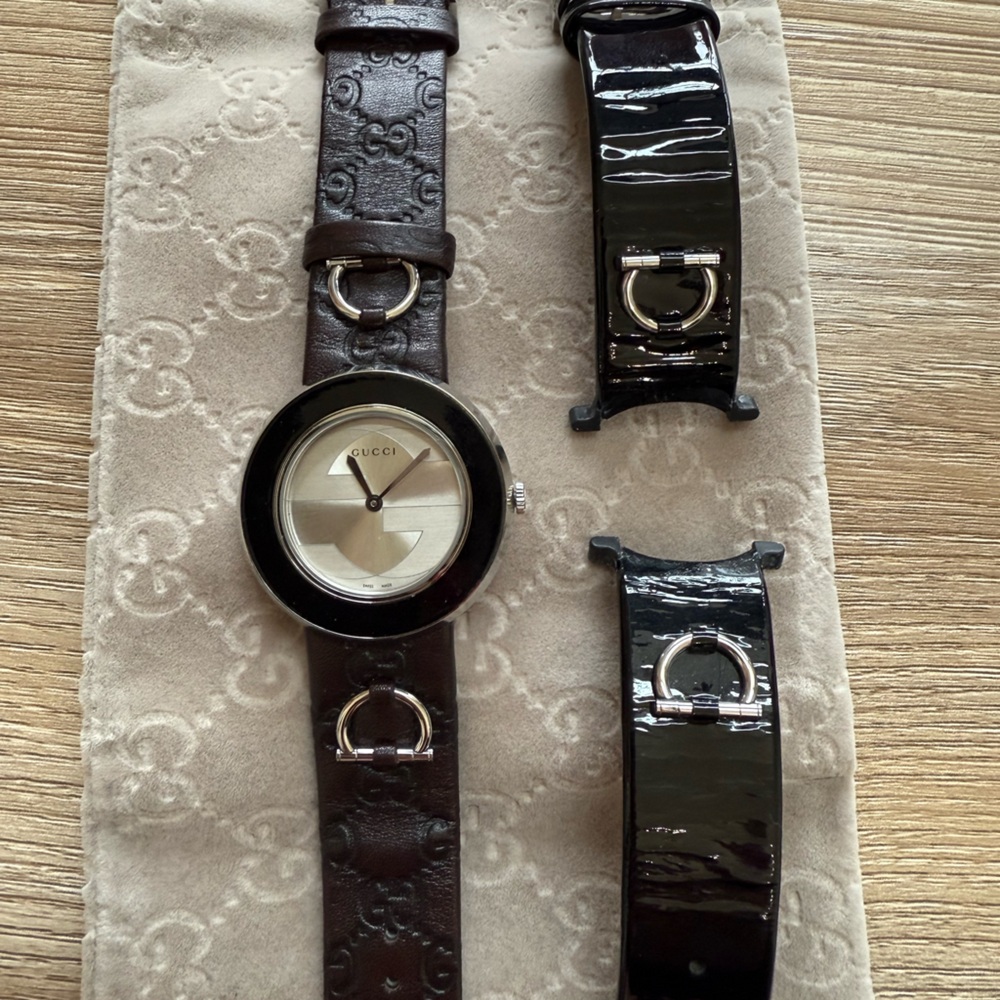 Gucci women’s watch with interchangeable brown and black bands!
